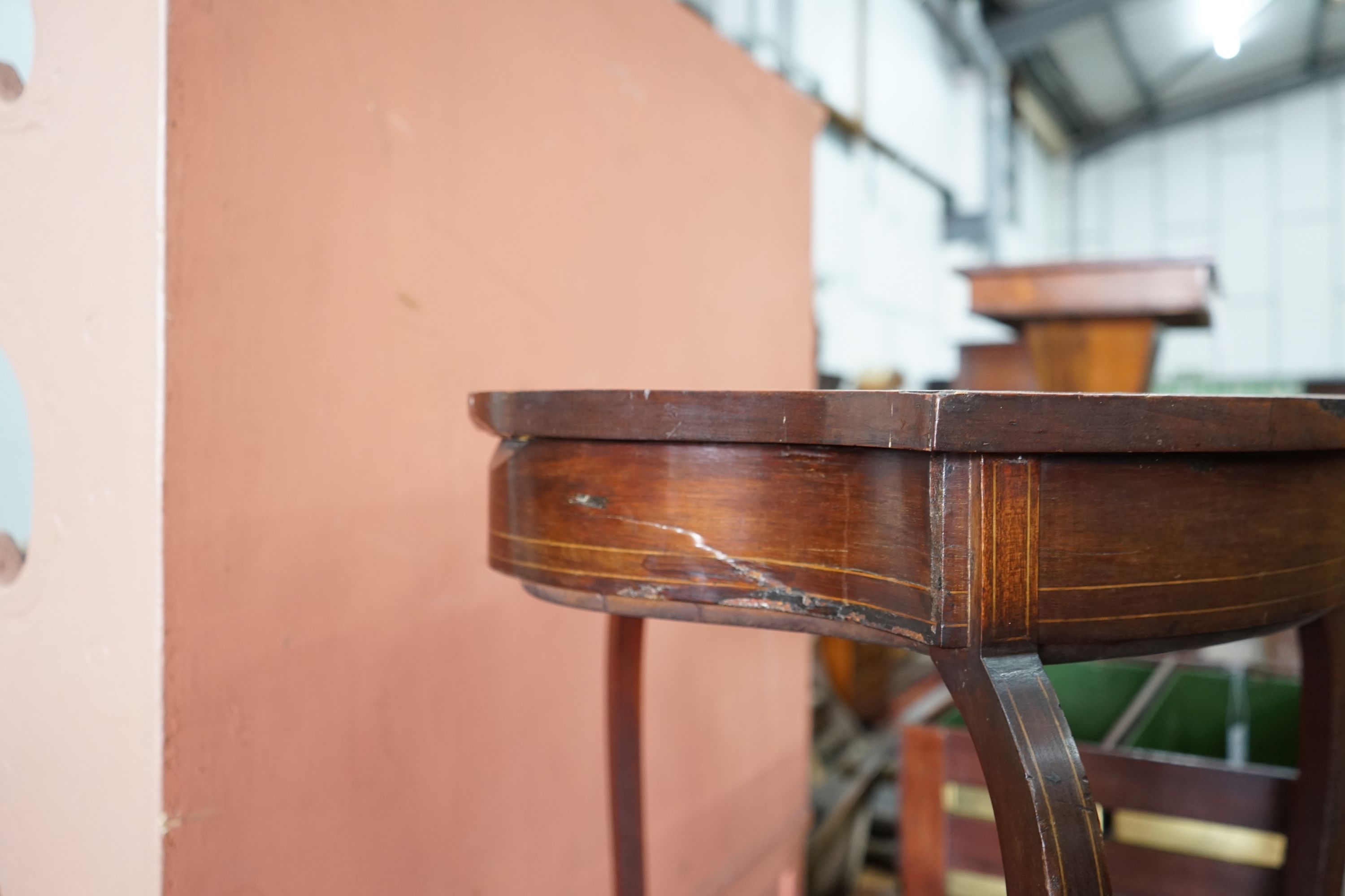 An Edwardian mahogany shield shaped bijouterie table, width 50cm, depth 59cm, height 72cm